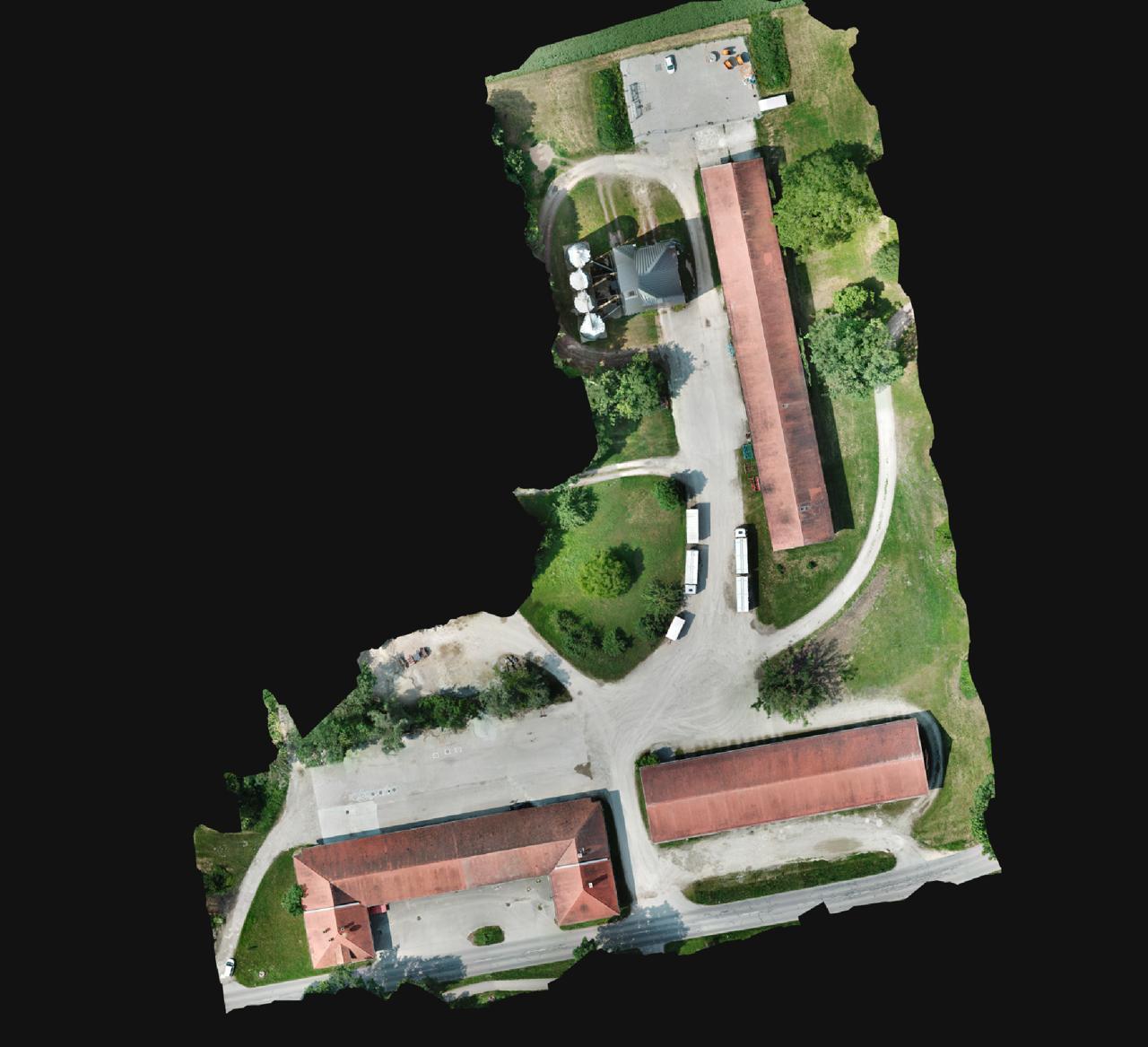 Orthomosaic of the TUM Roggenstein test site showing the three surveyed buildings and surrounding grounds